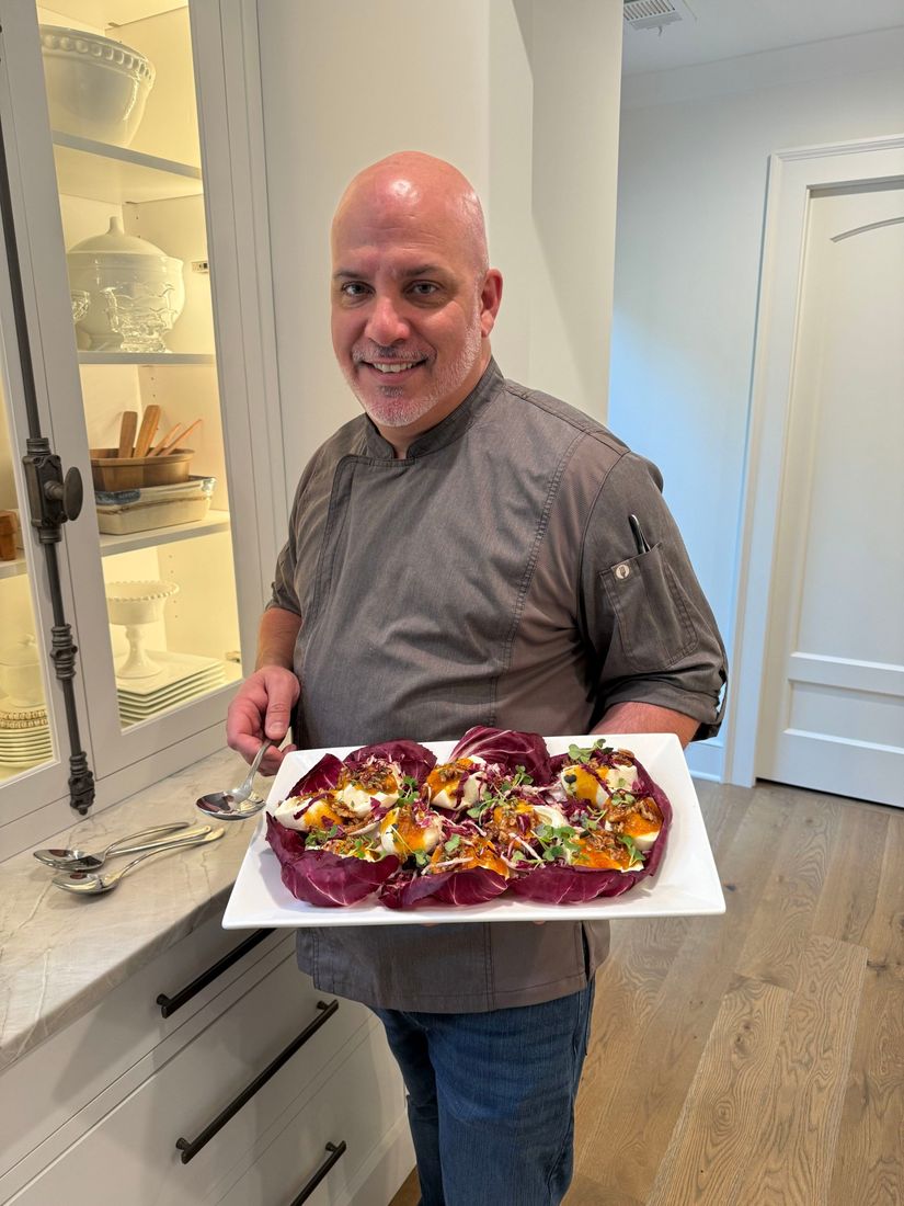 Chef Jackson Locklear serving a burrata and radicchio platter in a client home